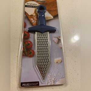 PelegDesign gratiator cheese grater. In original packaging. Has a blue…